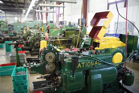 Cold-header machine at Mac Fasteners that generates oil mist from evaporated coolant