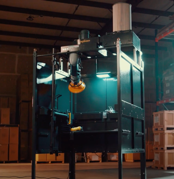 Fume Xtractors welding booth shown in an industrial facility.