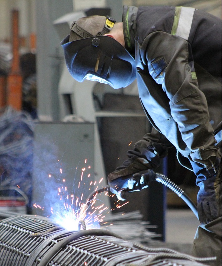 A machine operator working on a welding project.